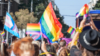 Making an Impact Where We Live and Work: Diversity, Inclusion & Belonging, and Pride at Applied Pride parade flags