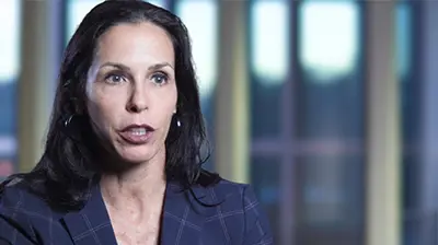 Bradley's Insurance Headshot of a woman looking forward, she is wearing business clothes