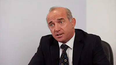 Creane & Creane Insurance Brokers A man in a suit responding to a question