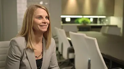 Drayden Insurance Ltd A business woman in a suit is being interviewed