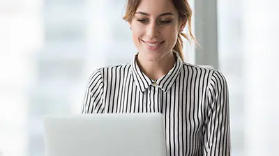 Digital Ecosystem of Insurance Infographic A woman in a striped blouse smiling at her open laptop