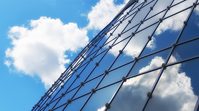 Applied Cloud A reflective dome reflecting blue sky and clouds